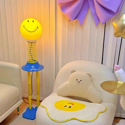 Contemporary Creative PVC Iron Smile Cartoon Character 1-Light Standing Floor Lamp For Living Room