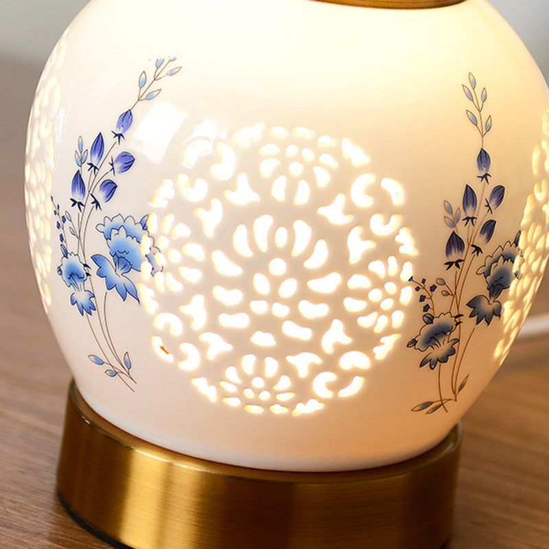 Traditional Chinese Round Table Ball Flower Hollowed Metal Ceramic Fabric 1-Light Table Lamp For Bedroom