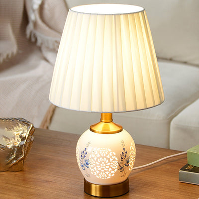 Traditional Chinese Round Table Ball Flower Hollowed Metal Ceramic Fabric 1-Light Table Lamp For Bedroom