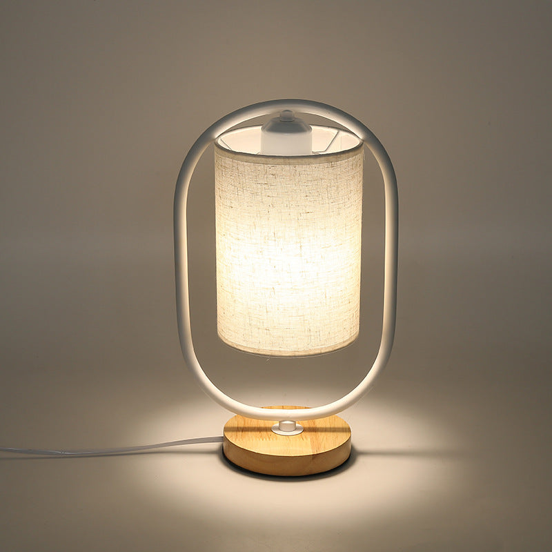 Contemporary Scandinavian Oval Cylinder Solid Wood Metal Fabric 1-Light Table Lamp For Bedroom