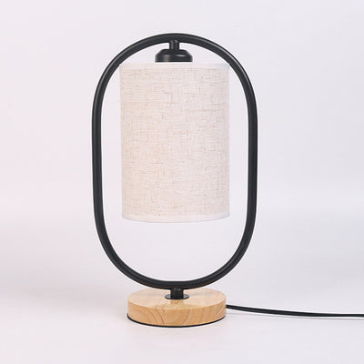 Contemporary Scandinavian Oval Cylinder Solid Wood Metal Fabric 1-Light Table Lamp For Bedroom