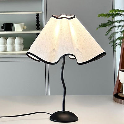 Contemporary Creative Fabric Petal Shade Curved Iron Base 1-Light Table Lamp For Bedroom