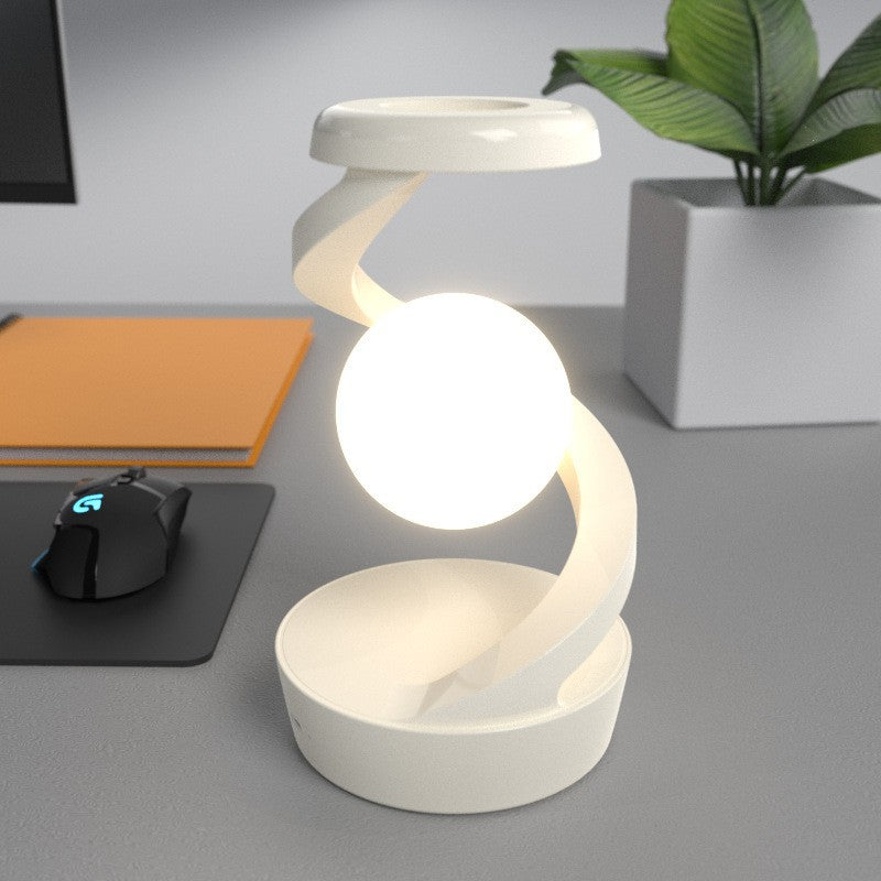 Contemporary Creative Rechargeable ABS Ball Rotating Suspension Wireless Charging LED Table Lamp Night Light For Bedside