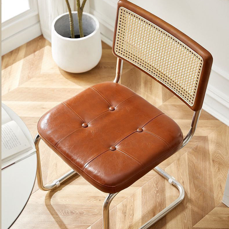 Contemporary Boho Rattan Leather Stainless Steel Dining Chair Backrest Armless For Dining Room