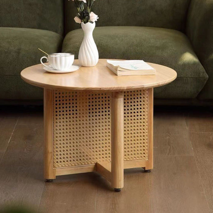 Table basse contemporaine ronde en bois avec tissage en rotin à pieds croisés pour salon 