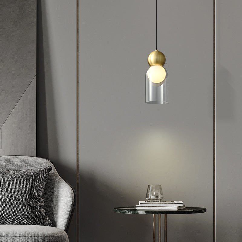 Lampe suspendue moderne à 1 lumière avec colonne en verre et boule de cuivre 