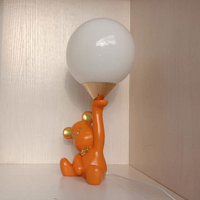 Lampe de table créative à 1 lumière en forme d'ours en céramique orange et boule de verre 